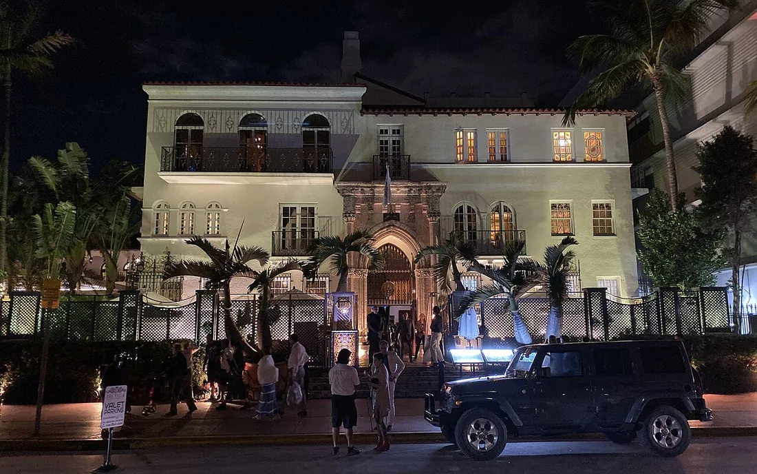 The lit facade of Casa Casuarina, on Ocean Drive